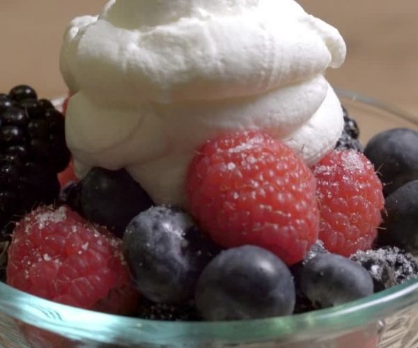 Let the mixture cool for a few minutes before stirring in all of the strawberries, raspberries, and blueberries